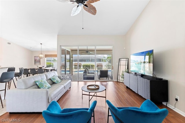 living room featuring a wealth of natural light, ceiling fan, and hardwood / wood-style floors