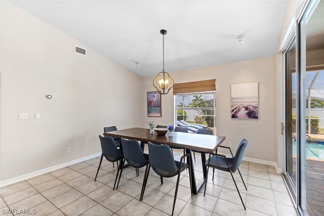 tiled dining area with a notable chandelier