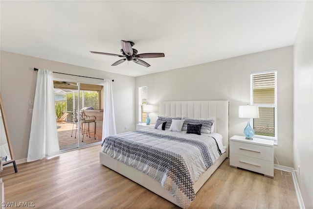 bedroom featuring light hardwood / wood-style floors, ceiling fan, and access to exterior