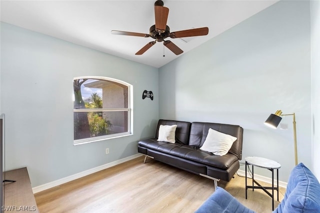 living room featuring ceiling fan and light wood-type flooring