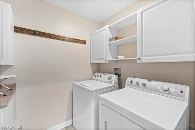 laundry area with independent washer and dryer, cabinets, and hookup for a washing machine