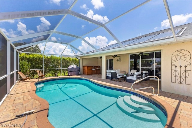 view of swimming pool with glass enclosure, an outdoor living space, ceiling fan, and a patio area