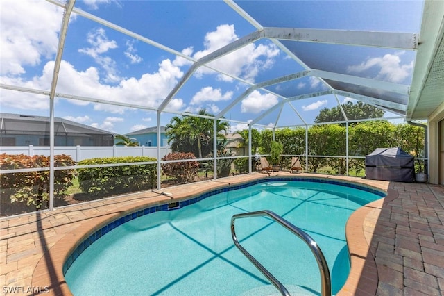 view of pool featuring a lanai and a patio area