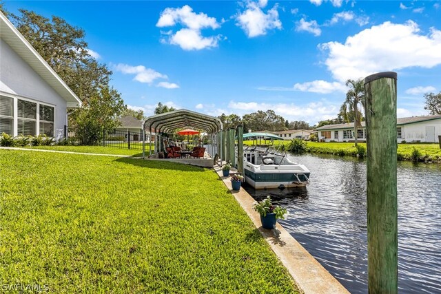 dock area featuring a yard and a water view