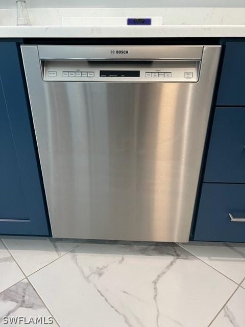 interior details with stainless steel dishwasher, light stone counters, and blue cabinets