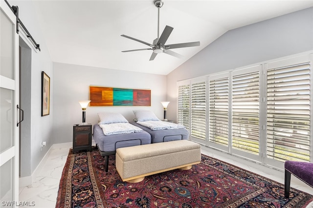 bedroom featuring ceiling fan, a barn door, and vaulted ceiling