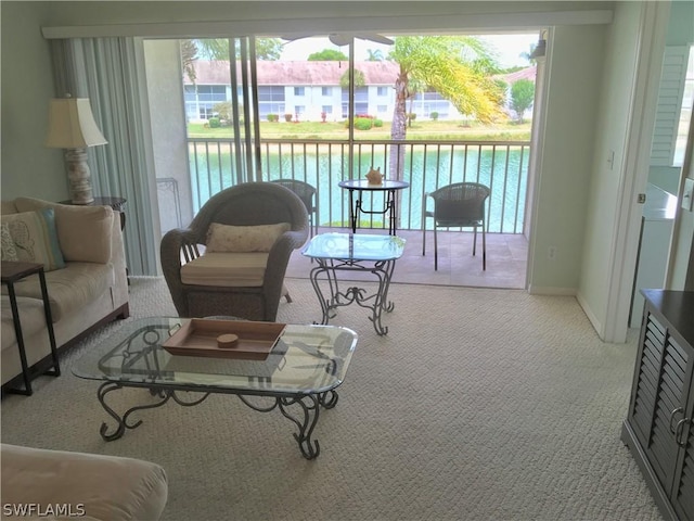 sunroom / solarium with a water view and a wealth of natural light