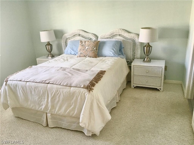 bedroom with light colored carpet