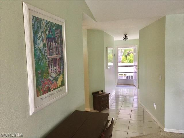 hallway featuring light tile patterned flooring