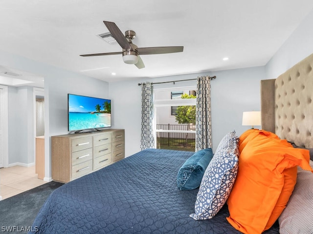 bedroom with ceiling fan and light colored carpet