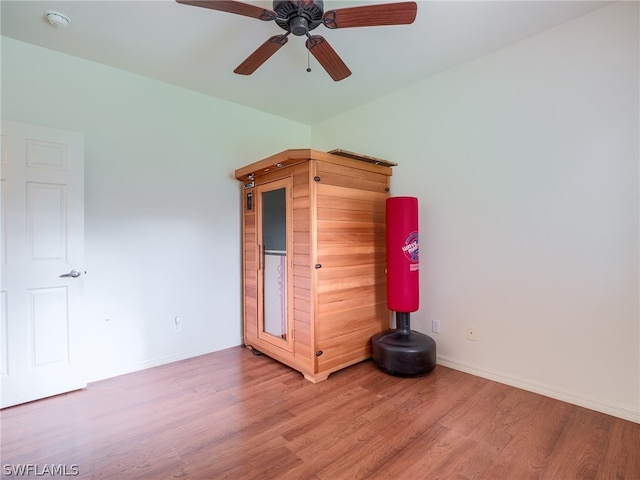 spare room featuring wood-type flooring and ceiling fan