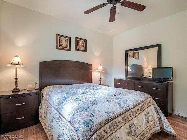 bedroom with ceiling fan and light hardwood / wood-style flooring