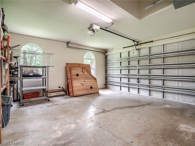 garage featuring a garage door opener