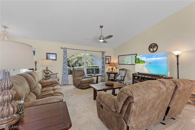 carpeted living room with ceiling fan and lofted ceiling