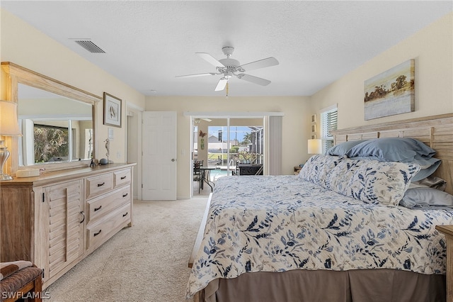 bedroom with ceiling fan, light colored carpet, access to outside, and multiple windows