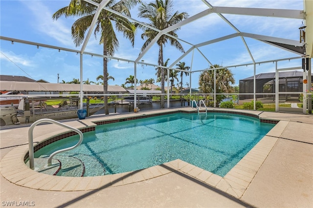 view of pool featuring a water view and a lanai