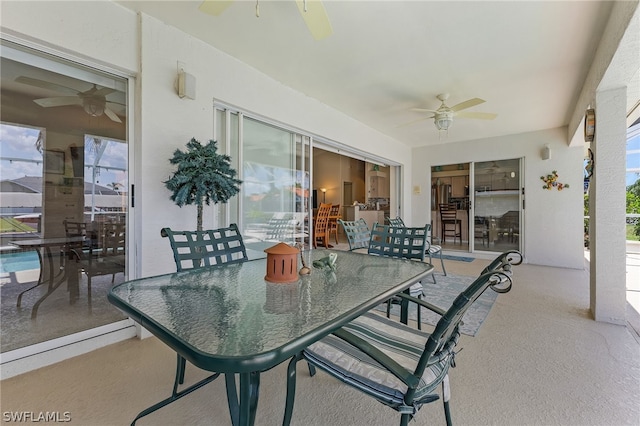 sunroom featuring ceiling fan