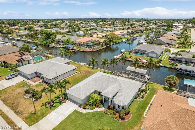 birds eye view of property with a water view