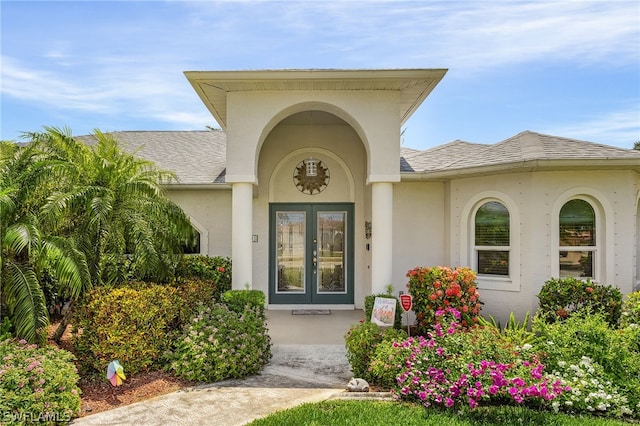 view of exterior entry featuring french doors