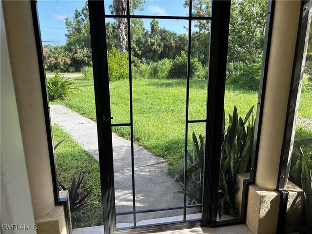 4720 22nd Ave SE, Naples, FL 34117 - doorway featuring healthy amount of natural light