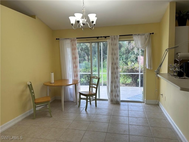 4720 22nd Ave SE, Naples, FL 34117 - dining room with a chandelier, baseboards, and light tile patterned floors