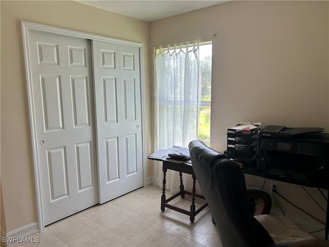 office area with light tile patterned floors