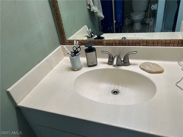 bathroom with vanity and toilet