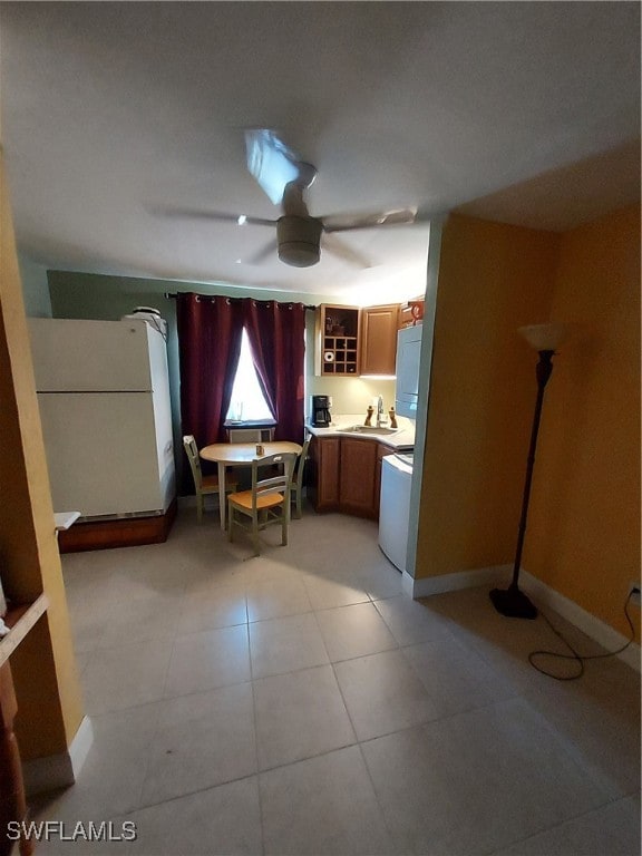 kitchen with white appliances and ceiling fan