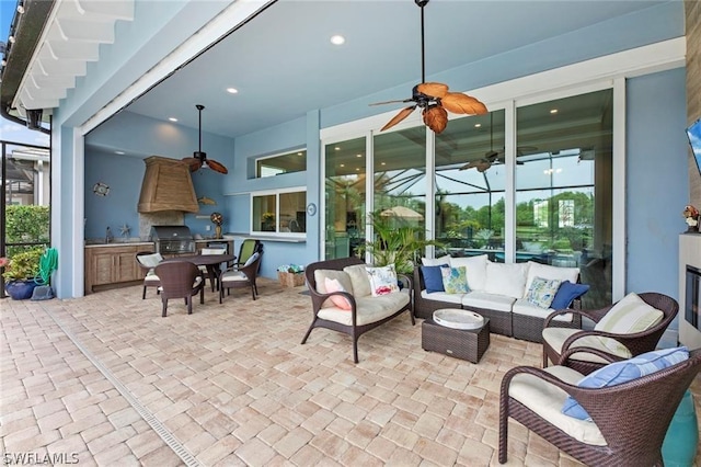 view of patio with area for grilling and an outdoor living space