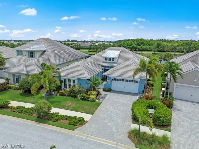 view of front facade featuring a front lawn and a garage