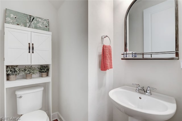 bathroom with toilet and sink