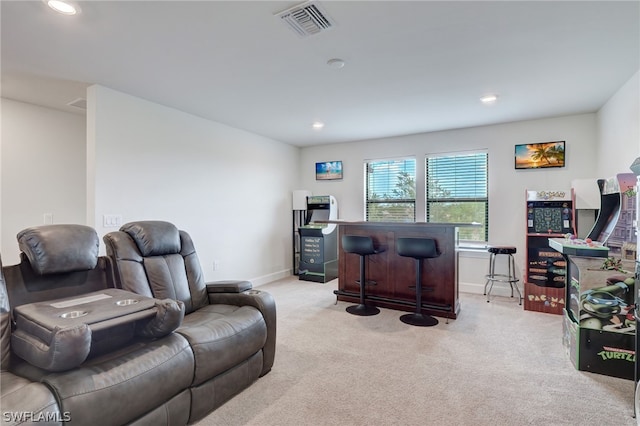 office space featuring light carpet and indoor bar