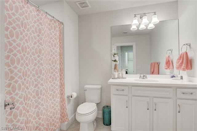 bathroom featuring walk in shower, vanity, and toilet