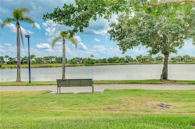 exterior space with a water view and a yard