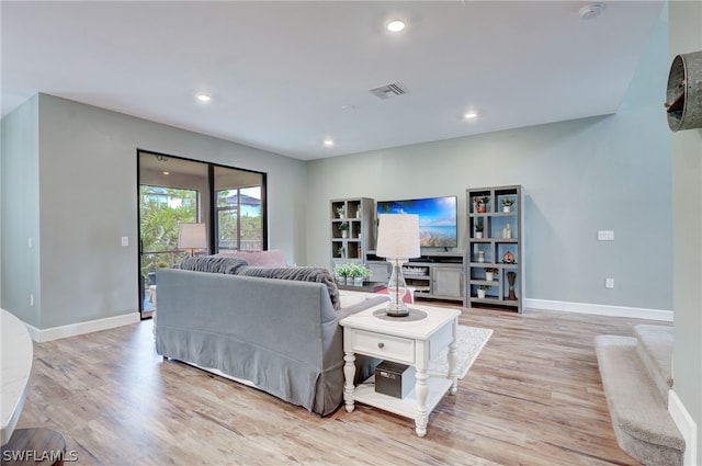 living room with light hardwood / wood-style flooring