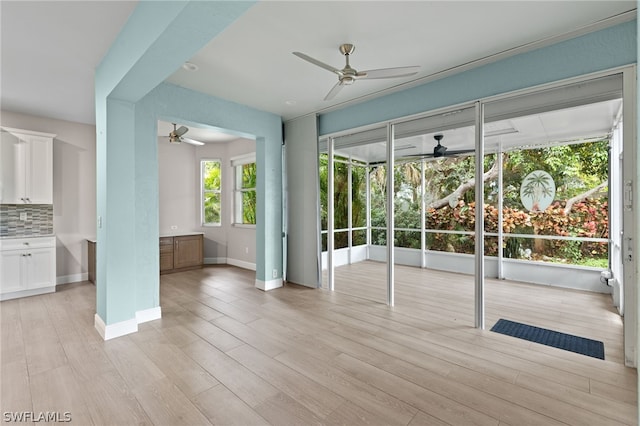 interior space featuring ceiling fan and light hardwood / wood-style flooring