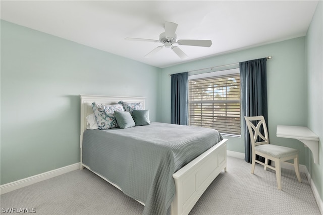 bedroom with ceiling fan and light colored carpet