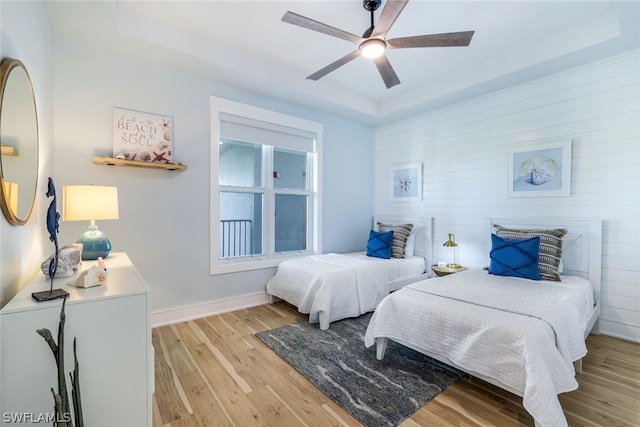 bedroom with light wood-type flooring and ceiling fan