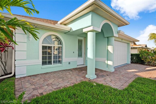 property entrance with a garage