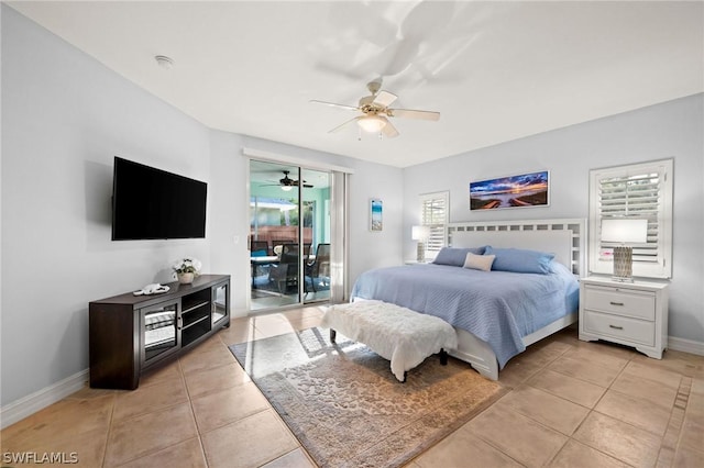 tiled bedroom with access to exterior, multiple windows, and ceiling fan