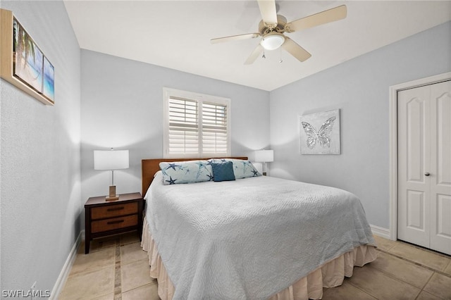 tiled bedroom with a closet and ceiling fan