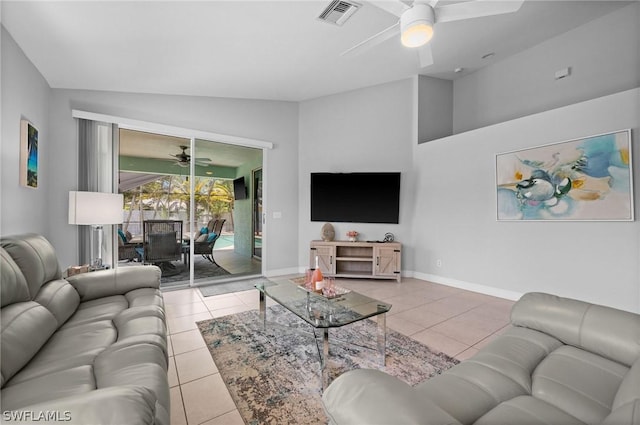 living room with ceiling fan, light tile patterned floors, and vaulted ceiling