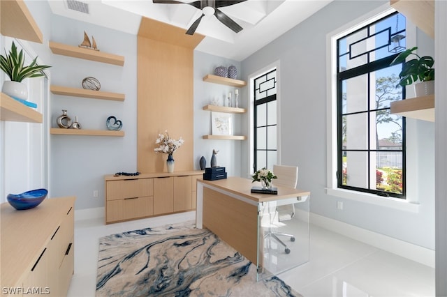 office area featuring ceiling fan, built in features, and light tile patterned floors