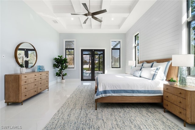 bedroom featuring ceiling fan, access to exterior, coffered ceiling, french doors, and beamed ceiling