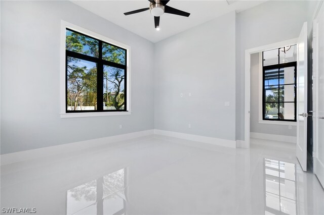 unfurnished room with plenty of natural light and ceiling fan