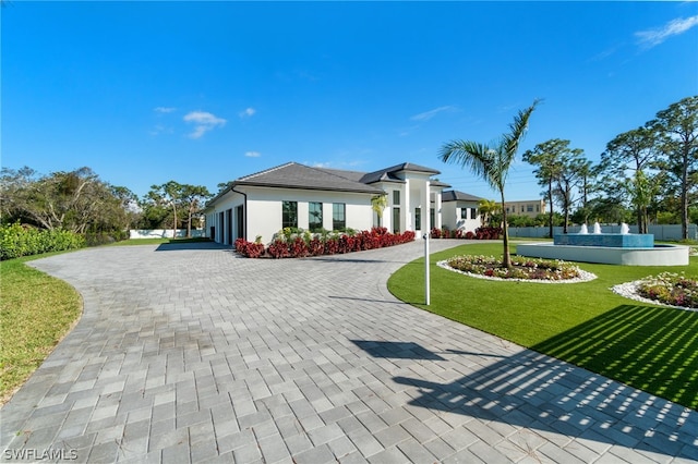 view of front of home with a front lawn