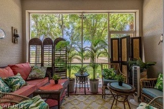 sunroom / solarium featuring a wealth of natural light