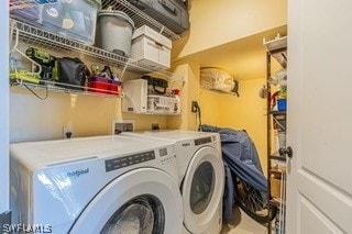 laundry room featuring washer hookup and washing machine and clothes dryer