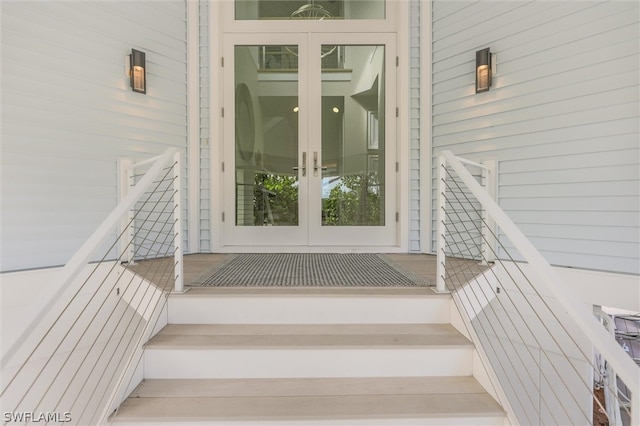 stairway featuring french doors