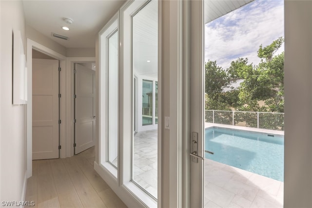 interior space featuring plenty of natural light and light hardwood / wood-style floors